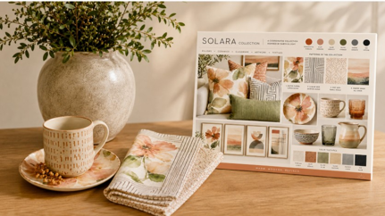 Solara collection display with ceramic, glassware and textile items.